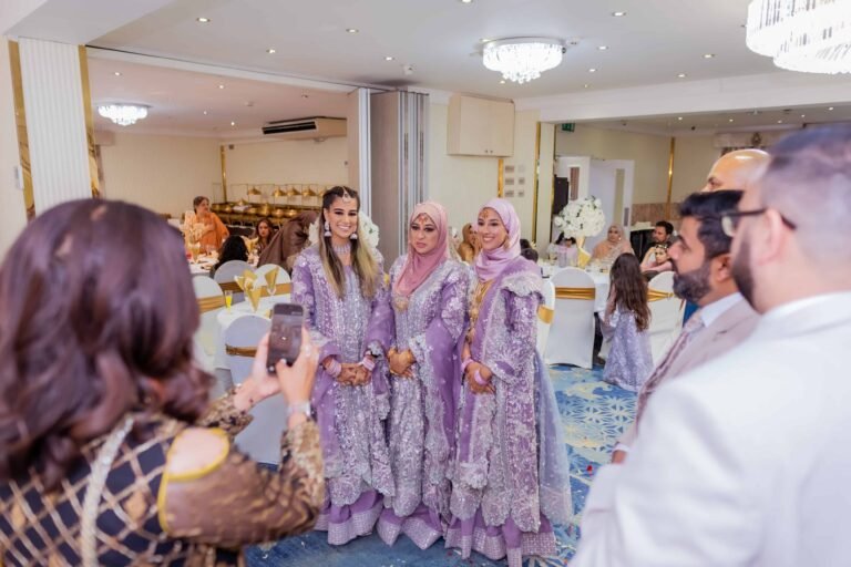 Guests in lilac outfits gathered at a wedding reception