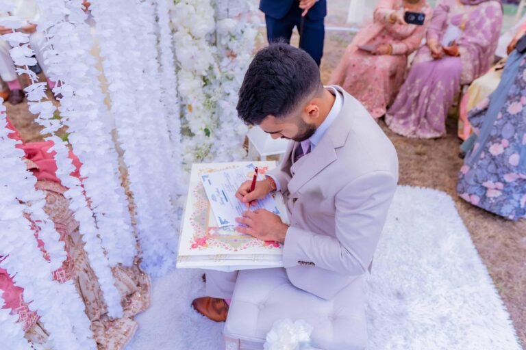 Groom signing the marriage documents during the ceremony
